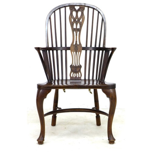 293 - A set of six oak Windsor armchairs, mid 20th century, each with a pierced wheat and floral decorated... 