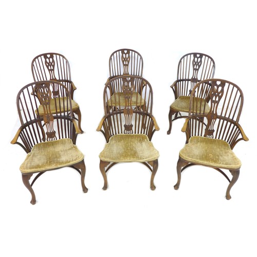 293 - A set of six oak Windsor armchairs, mid 20th century, each with a pierced wheat and floral decorated... 