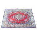 A Mahal rug, red ground with pale blue corners, central floral motif with multiple cream, floral bor... 