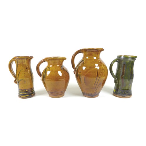 19 - Clive Bowen (British, b. 1943): a group of three Studio pottery jugs, with brown and green glazes, 2... 
