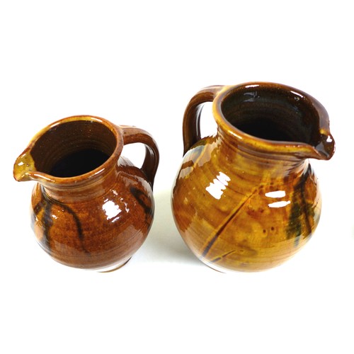 19 - Clive Bowen (British, b. 1943): a group of three Studio pottery jugs, with brown and green glazes, 2... 