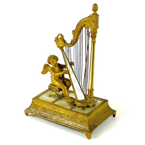 106 - A French Palais Royale ormolu jewel stand incorporating a music box, early 19th century, in the form...