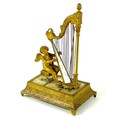 A French Palais Royale ormolu jewel stand incorporating a music box, early 19th century, in the form... 