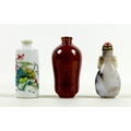 A group of three Chinese miniature bottles, comprising a carved hardstone scent bottle, 7cm high, a ... 