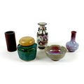 A group of five Chinese ceramic items, comprising a bottle vase, 15cm high, and bowl, 7cm high, deco... 