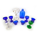 A mixed collection of glass items, including a hand blown drinking glass, with copper coloured beadi... 