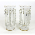 A pair of Victorian white glass lustres,with cut glass drops, gilt highlights, each 12.5 by 27cm hig... 