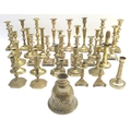 A collection of Georgian/Victorian and later brass candlesticks, many in pairs, including several ej... 