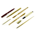 A collection of vintage pens, comprising a Montblanc Classic ballpoint pen, burgundy and gold, 13cm,... 