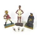 A group of three advertising mascot figures, comprising a 1950s table top advertising model for mens... 