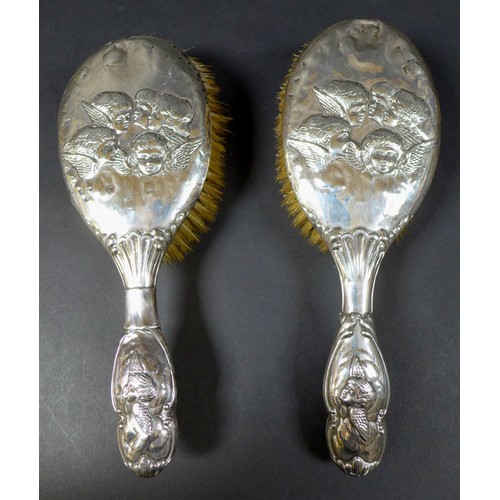 15 - A collection of Edwardian silver dressing table items,  comprising two hair brushes, two clothes bru... 