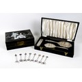 A sterling silver four piece dressing table set, with three silver backed hair brushes and one comb,... 