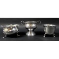 A group of three silver bon bon dishes, comprising a twin handled dish, raised on a circular foot wi... 