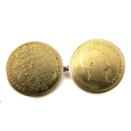 33 - A pair of cufflinks formed of gold shield back half sovereigns, soldered loop fittings and joined by... 