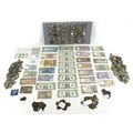 A collection of international coins and banknotes, including a sealed Banco Central de Reserva del P... 