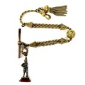 An 18th century gilt brass Albert fob chain, formed of a double stranded twist chain separated by fa... 