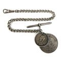 A Victorian silver Albert fob chain, 25.5cm long, with two silver coins attached, one Victorian, the... 
