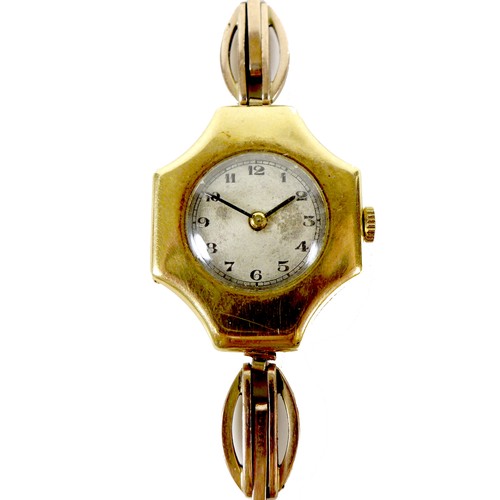 75 - An Art Deco 18ct gold cased lady's wristwatch, with cross shaped case, circular silvered dial, black... 