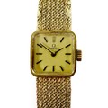 A vintage Omega 9ct gold lady's wristwatch, model 1061, circa 1973, the square matte gold dial with ... 