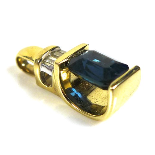 106 - A 14ct gold, synthetic sapphire, and diamond pendant, the royal blue emerald cut synthetic sapphire,... 