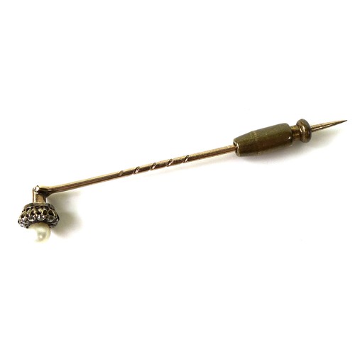 127 - A yellow metal stick pin, the removable head set with a cultured pearl surrounded by ten diamonds, 6... 