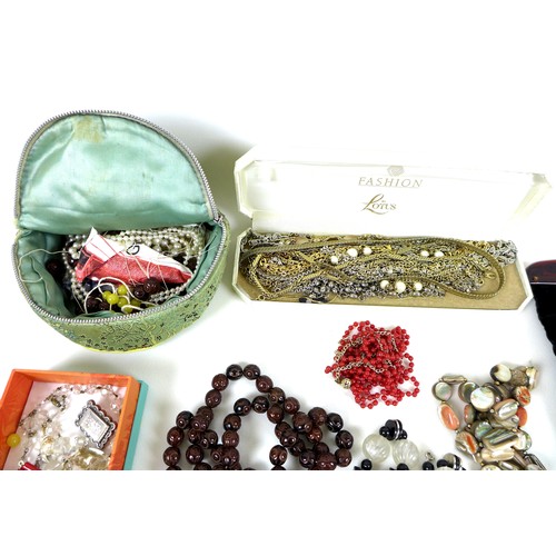 104 - A large collection of costume jewellery, including several silver, gold and amber items. (1 bag)