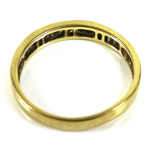 179 - An 18ct yellow gold and diamond set half eternity ring, the row of baguette cut stones approximately... 