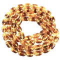 An amber bead necklace, each bead 18mm long, overall weight 133.9g, 120cm long.