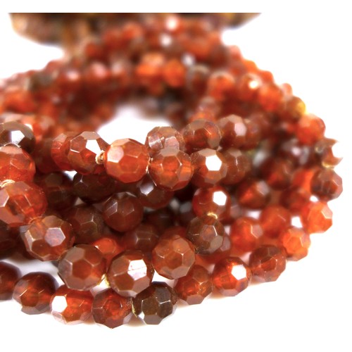 105 - A rough hewn amber necklace, 190cm long overall, 98.4g, together with a another amber style necklace... 