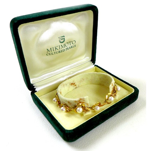 182 - A vintage Mikimoto 18ct gold and cultured pearl bracelet, orb and leaf design, with safety chain, ma... 