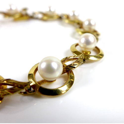 182 - A vintage Mikimoto 18ct gold and cultured pearl bracelet, orb and leaf design, with safety chain, ma... 