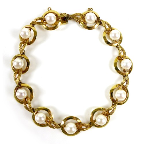 182 - A vintage Mikimoto 18ct gold and cultured pearl bracelet, orb and leaf design, with safety chain, ma... 