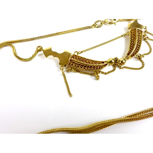 185 - A group of three 18ct gold necklaces, one with a double kris design, the others with 18ct gold penda... 