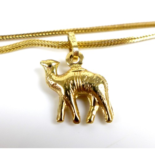 185 - A group of three 18ct gold necklaces, one with a double kris design, the others with 18ct gold penda... 