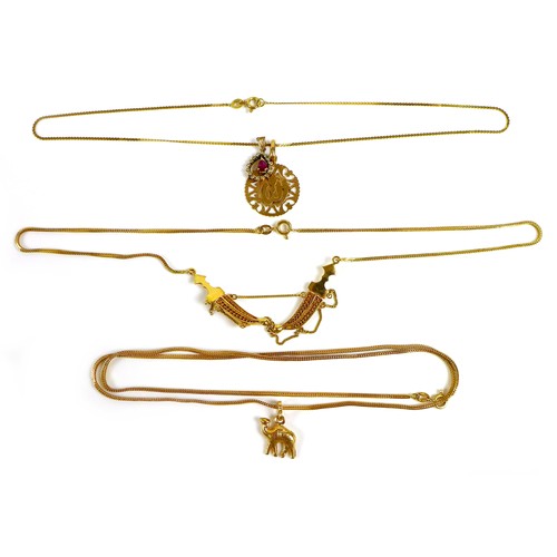 185 - A group of three 18ct gold necklaces, one with a double kris design, the others with 18ct gold penda... 