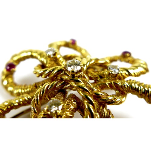 186 - An 18ct gold, diamond and ruby flower brooch, the petals formed as twisted rope design loops, set wi... 