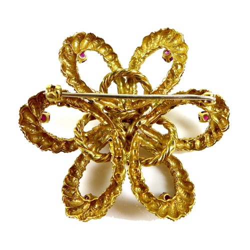 186 - An 18ct gold, diamond and ruby flower brooch, the petals formed as twisted rope design loops, set wi... 