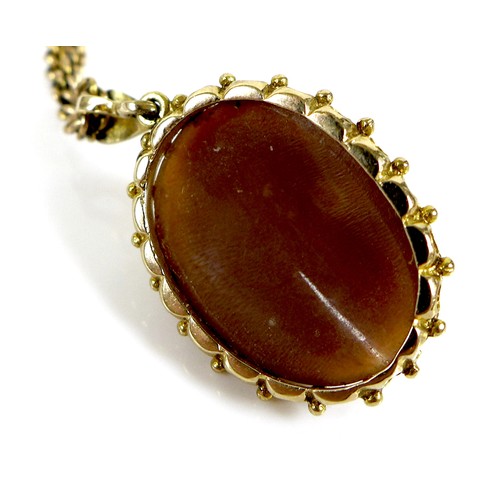 111 - A 9ct gold framed cameo pendant on a 9ct gold chain, 11.2g total, together with a yellow metal cameo... 