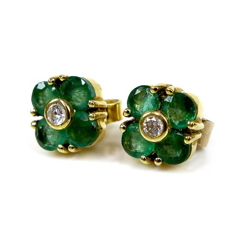 119 - A pair of gold, diamond and emerald earrings of quatrefoil flowerhead design, 6.4 by 6.4mm, 1.9g.