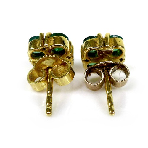 119 - A pair of gold, diamond and emerald earrings of quatrefoil flowerhead design, 6.4 by 6.4mm, 1.9g.