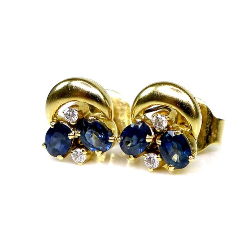 128 - A pair of 18ct gold, sapphire and diamond earrings, each formed of two oval cut sapphires and two br... 