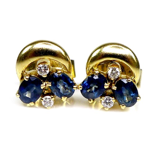 128 - A pair of 18ct gold, sapphire and diamond earrings, each formed of two oval cut sapphires and two br... 