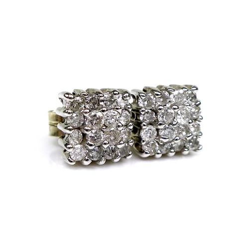 129 - A pair of 18ct white gold and diamond stud earrings, of square design each formed of sixteen brillia... 