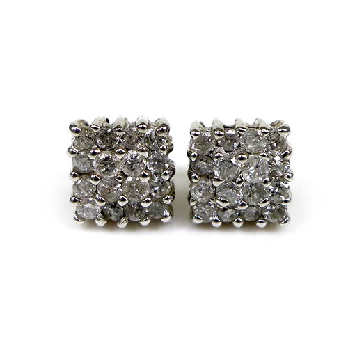 129 - A pair of 18ct white gold and diamond stud earrings, of square design each formed of sixteen brillia... 