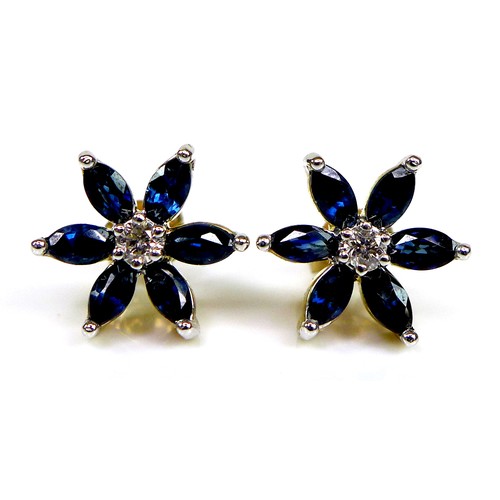 130 - A pair of 9ct gold, sapphire and diamond flowerhead stud earrings, six petalled design formed of mar... 