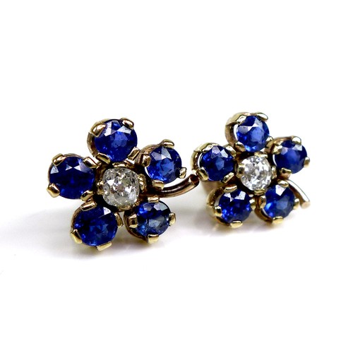 131 - A pair of gold, sapphire and diamond flowerhead earrings, formed of five round cut royal blue sapphi... 