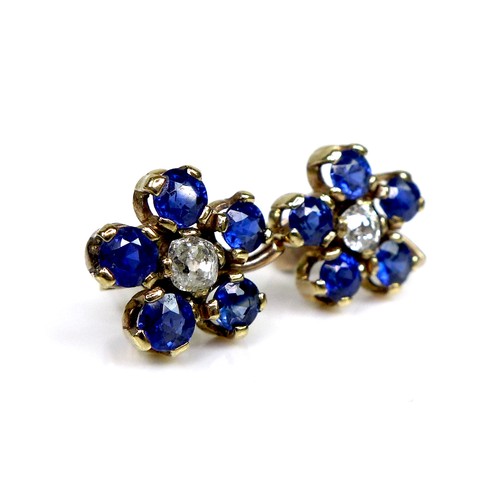 131 - A pair of gold, sapphire and diamond flowerhead earrings, formed of five round cut royal blue sapphi... 