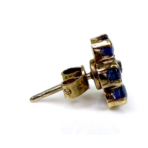 131 - A pair of gold, sapphire and diamond flowerhead earrings, formed of five round cut royal blue sapphi... 