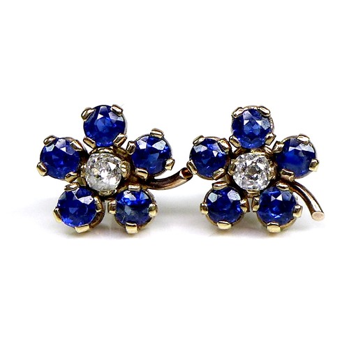 131 - A pair of gold, sapphire and diamond flowerhead earrings, formed of five round cut royal blue sapphi... 