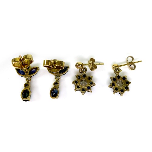 87 - Two pairs of gold and sapphire drop stud earrings, the first of flowerhead design with central white... 